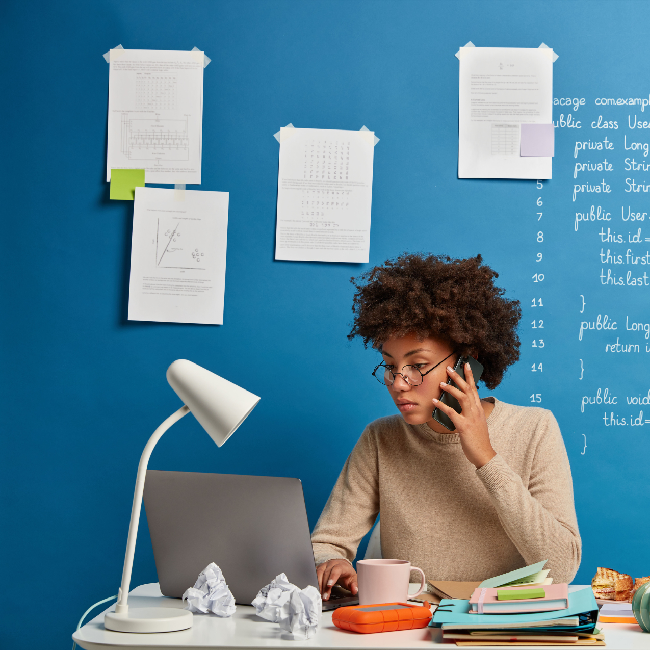 A busy girl working on laptop with so many torn paper around her with Copywriting Mistakes concept